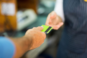 customer paying with credit card in store