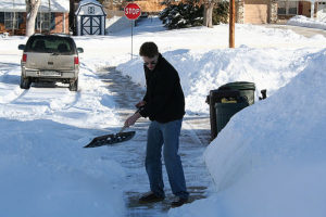 clear the sidewalk shoveling snow