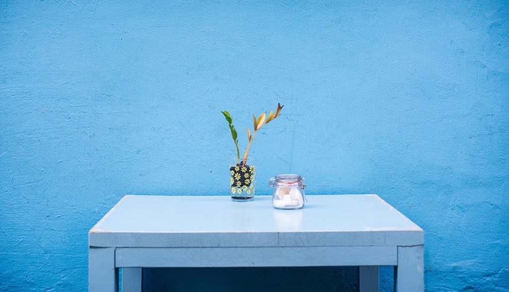 Minimal furniture with a blue wall