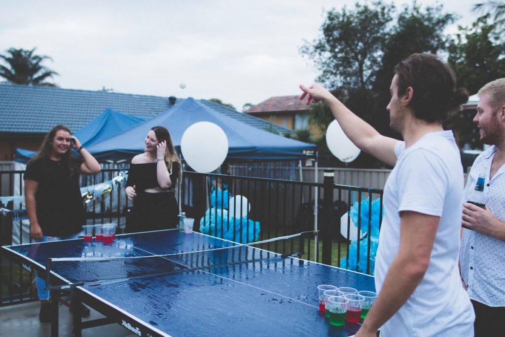People playing beer pong outside