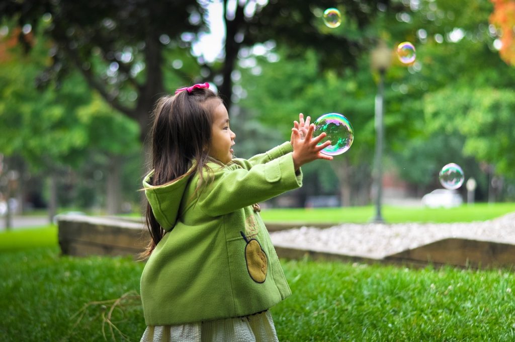 Child chasing a bubble