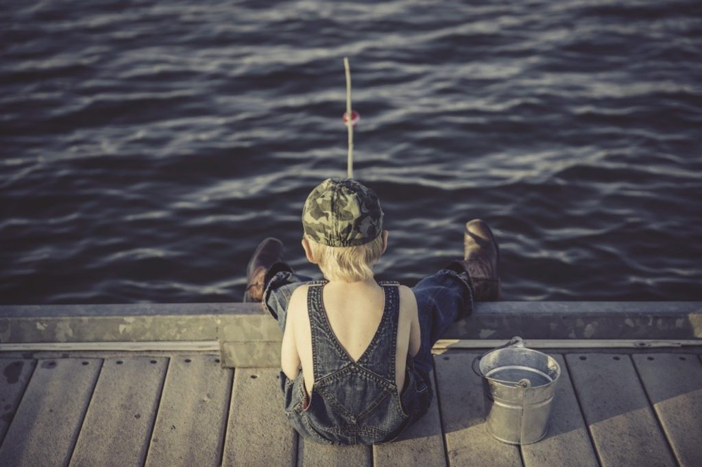 Boy fishing on a dock