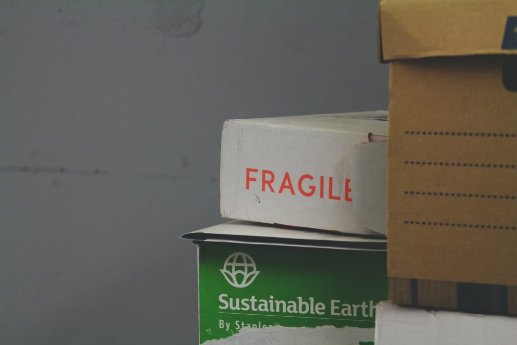 Boxes stacked up, one says "fragile" in red