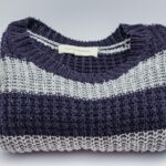 Folded blue and white striped sweater