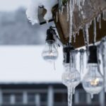 Ice and snow dripping from the roof of a home.